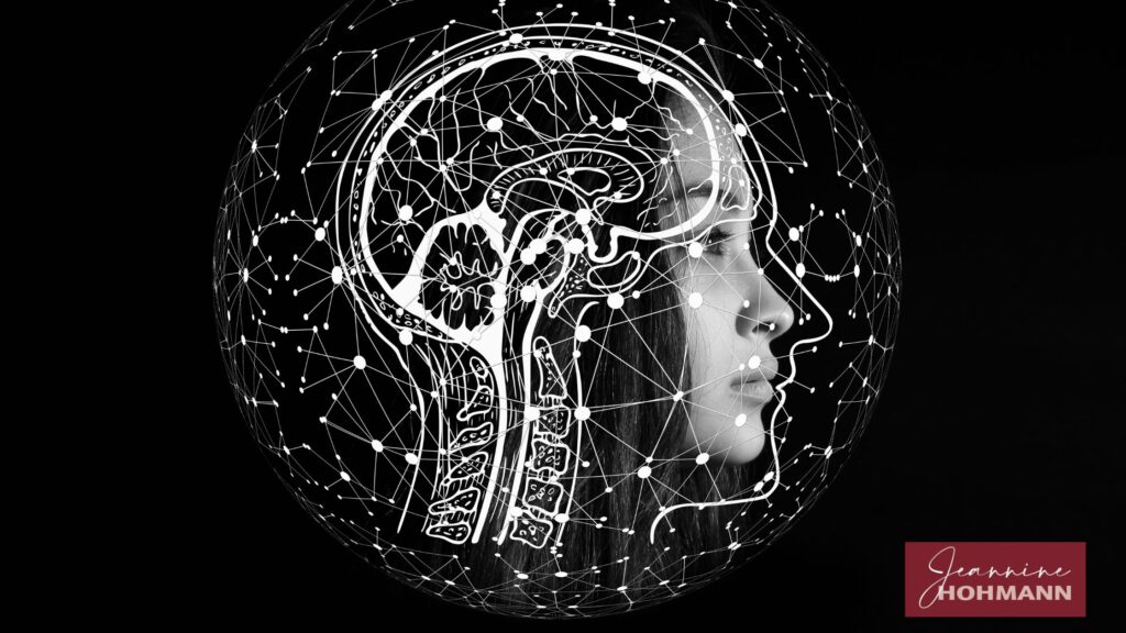 Kopf im Profil mit leuchtendem Netz aus Linien als Symbol für das Gehirn